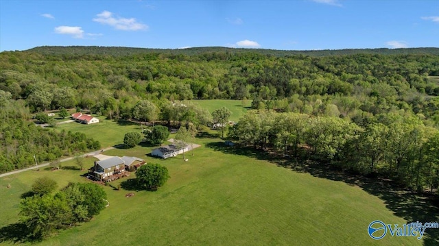 aerial view with a rural view and a wooded view