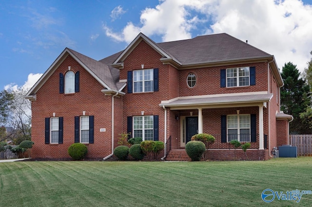 colonial-style house with a front yard