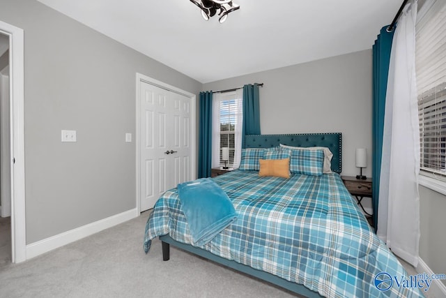 carpeted bedroom with a closet