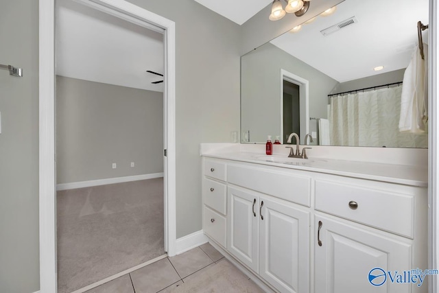 bathroom featuring tile patterned flooring and vanity