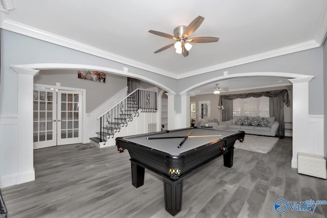 rec room with decorative columns, ornamental molding, and hardwood / wood-style flooring