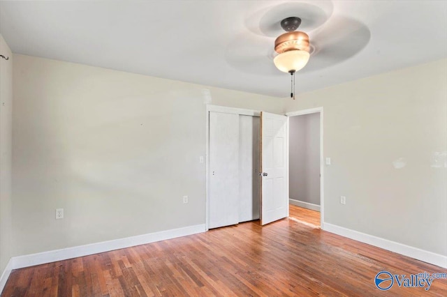 unfurnished room with hardwood / wood-style floors and ceiling fan