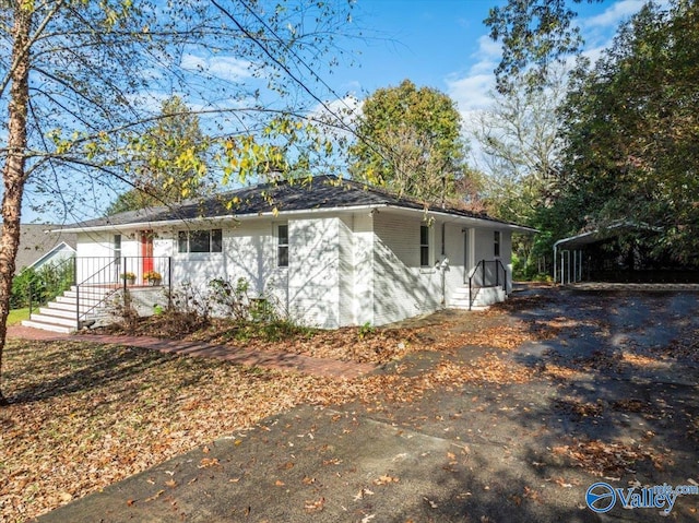 view of front of house featuring a carport