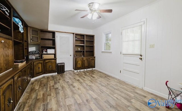 office with ceiling fan, light wood-type flooring, baseboards, and crown molding