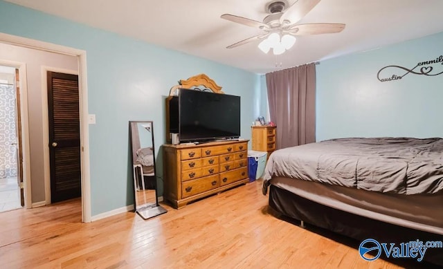 bedroom featuring light wood-style flooring, baseboards, and a ceiling fan