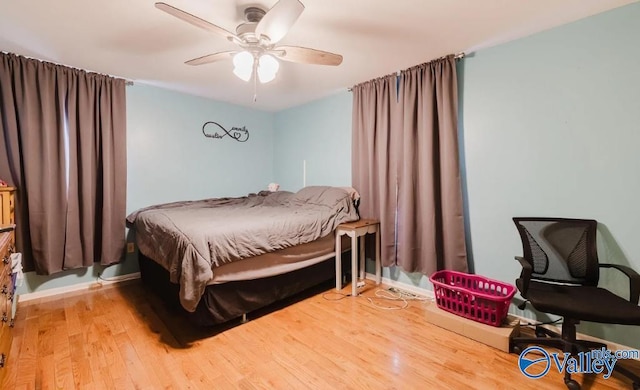 bedroom featuring ceiling fan and wood finished floors