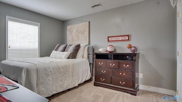 bedroom with light colored carpet