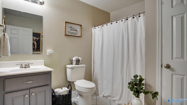 bathroom featuring tile patterned floors, vanity, toilet, and a shower with curtain