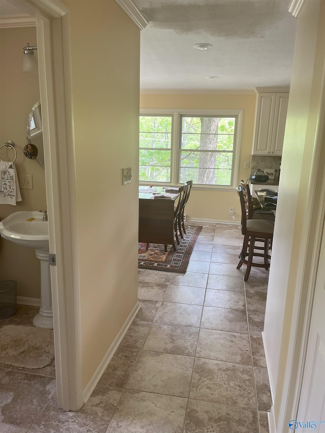 6818 Criner Rd SE, Huntsville, AL 35802 - hall featuring baseboards, ornamental molding, and a sink