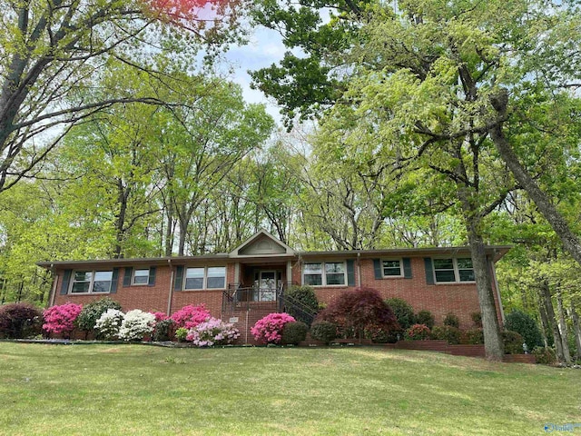 6818 Criner Rd SE, Huntsville, AL 35802 - view of front of home with brick siding and a front lawn