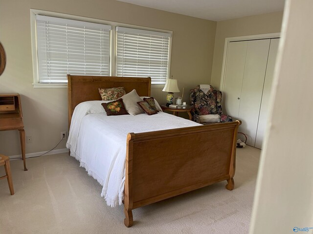 6818 Criner Rd SE, Huntsville, AL 35802 - carpeted bedroom featuring baseboards, a closet, and multiple windows