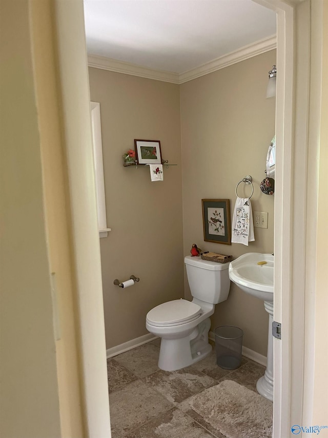 6818 Criner Rd SE, Huntsville, AL 35802 - half bathroom featuring toilet, ornamental molding, and baseboards