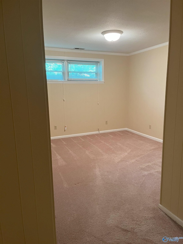 6818 Criner Rd SE, Huntsville, AL 35802 - unfurnished room featuring light colored carpet, ornamental molding, baseboards, and a textured ceiling