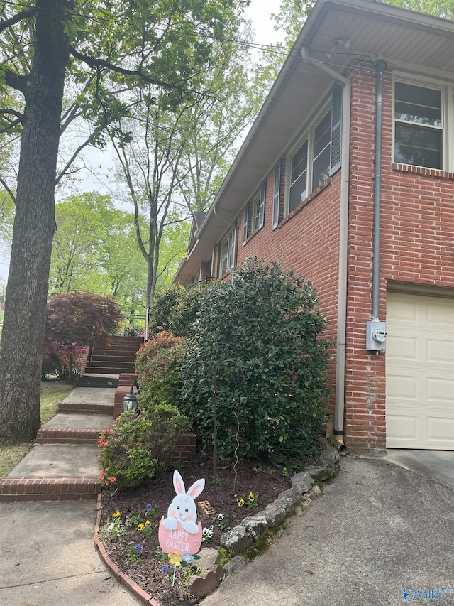 6818 Criner Rd SE, Huntsville, AL 35802 - view of home's exterior featuring brick siding and a garage