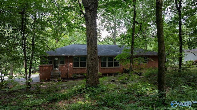 6818 Criner Rd SE, Huntsville, AL 35802 - view of front facade featuring brick siding and roof with shingles