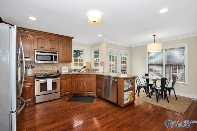 2616 Bransford Trl SE, Owens Cross Roads, AL 35763 - kitchen featuring a peninsula, light stone countertops, dark wood-type flooring, stainless steel appliances, and a sink