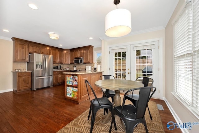 2616 Bransford Trl SE, Owens Cross Roads, AL 35763 - dining room with crown molding, french doors, baseboards, and dark wood finished floors