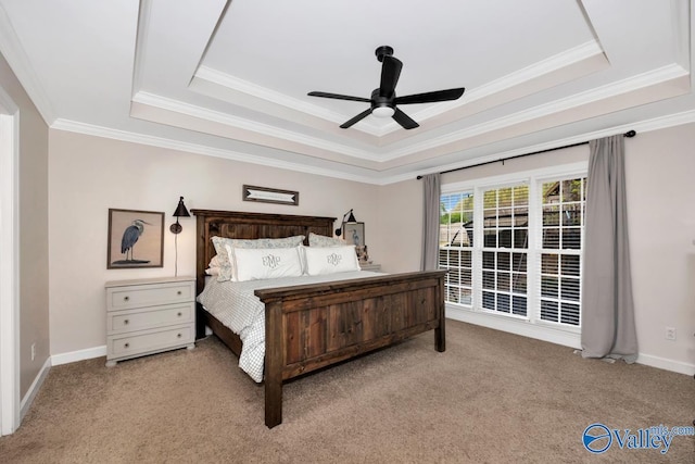 2616 Bransford Trl SE, Owens Cross Roads, AL 35763 - carpeted bedroom featuring baseboards, a tray ceiling, ornamental molding, and a ceiling fan