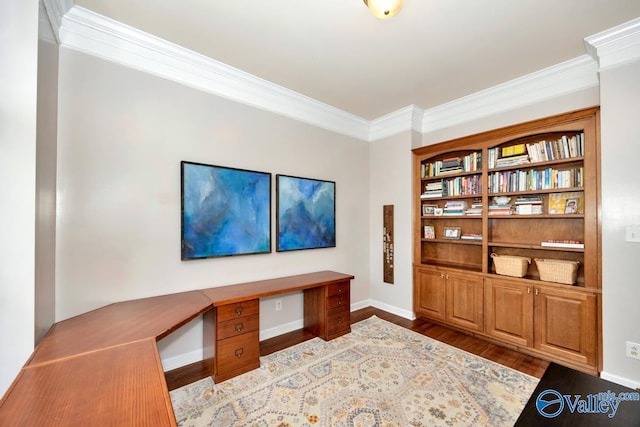 2616 Bransford Trl SE, Owens Cross Roads, AL 35763 - home office featuring built in desk, wood finished floors, baseboards, and ornamental molding