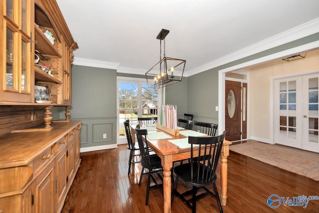 2616 Bransford Trl SE, Owens Cross Roads, AL 35763 - dining space with crown molding, french doors, an inviting chandelier, and dark wood-style floors