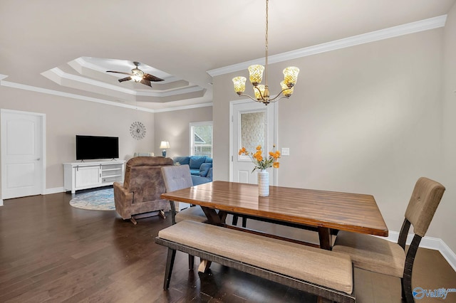 158 Kenton Ln, Madison, AL 35756 - dining space featuring baseboards, crown molding, dark wood-type flooring, a tray ceiling, and ceiling fan with notable chandelier