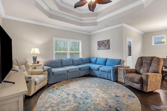 158 Kenton Ln, Madison, AL 35756 - living area with crown molding, a tray ceiling, a ceiling fan, and dark wood finished floors