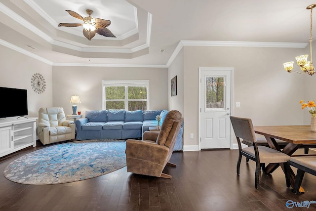158 Kenton Ln, Madison, AL 35756 - living area featuring dark wood-type flooring, a raised ceiling, ceiling fan with notable chandelier, and visible vents