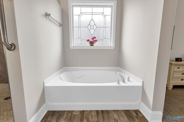 158 Kenton Ln, Madison, AL 35756 - bathroom with baseboards, wood finished floors, and a garden tub