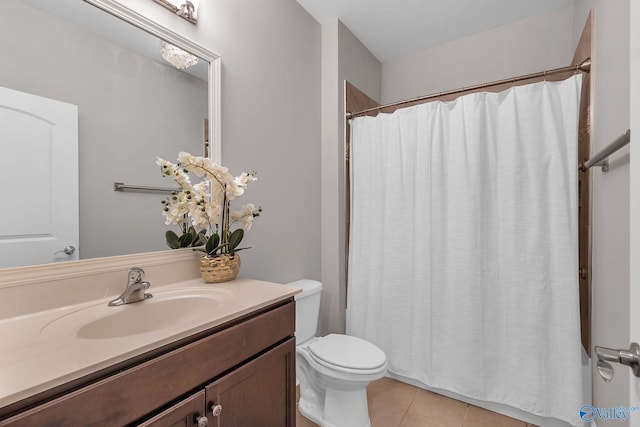 158 Kenton Ln, Madison, AL 35756 - full bathroom with tile patterned floors, curtained shower, vanity, and toilet