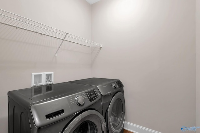 158 Kenton Ln, Madison, AL 35756 - laundry room featuring separate washer and dryer, laundry area, and baseboards