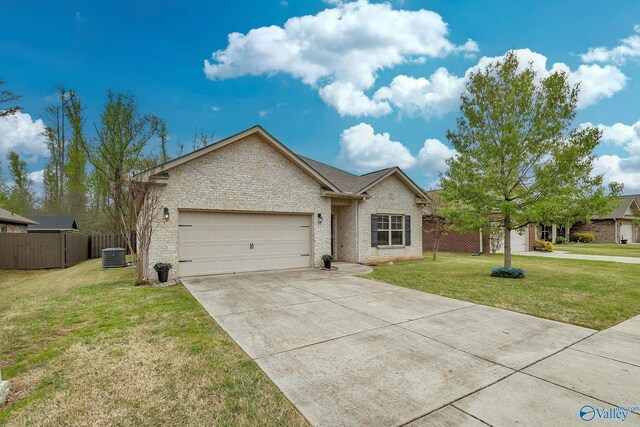 158 Kenton Ln, Madison, AL 35756 - single story home with driveway, an attached garage, a front lawn, central AC unit, and fence