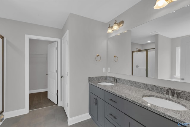 bathroom with vanity, tile patterned floors, and walk in shower