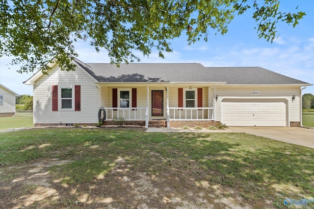 ranch-style house featuring a porch, a garage, and a front yard