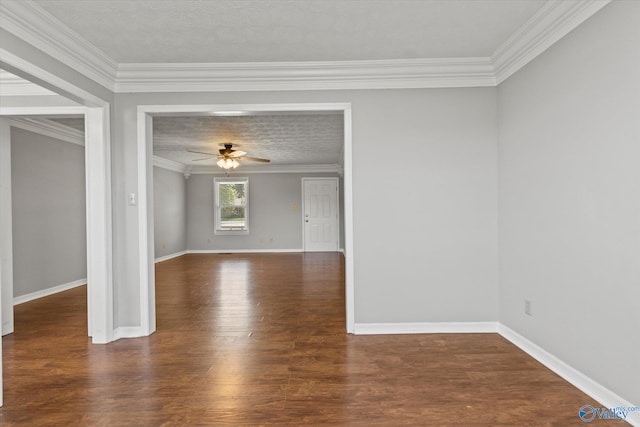 spare room with ceiling fan, dark hardwood / wood-style floors, and crown molding