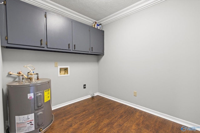 interior space with washer hookup, electric water heater, a textured ceiling, ornamental molding, and dark hardwood / wood-style floors