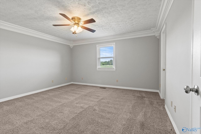 carpeted spare room with a textured ceiling, ornamental molding, and ceiling fan