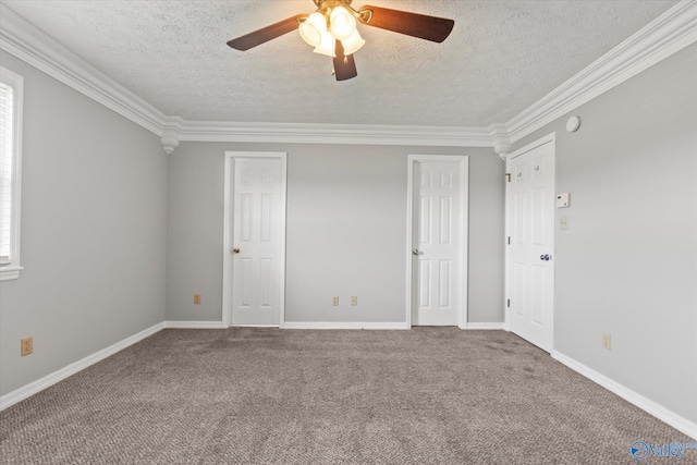 unfurnished bedroom featuring ceiling fan, a textured ceiling, crown molding, and carpet flooring