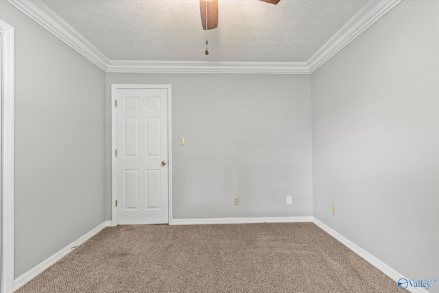 carpeted empty room with ornamental molding, ceiling fan, and a textured ceiling