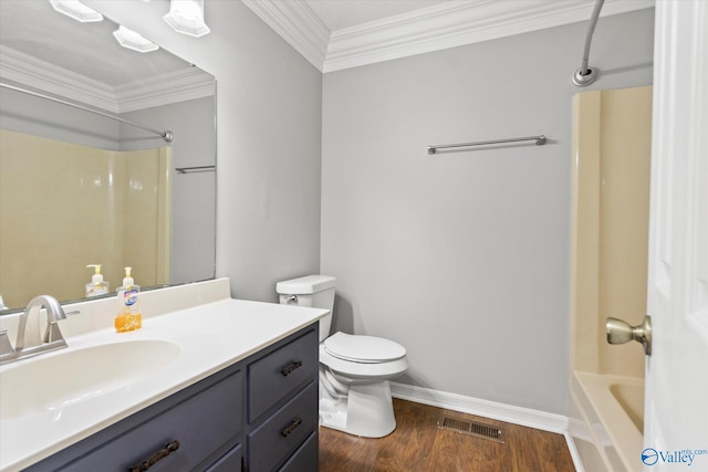 full bathroom with bathing tub / shower combination, vanity, crown molding, wood-type flooring, and toilet