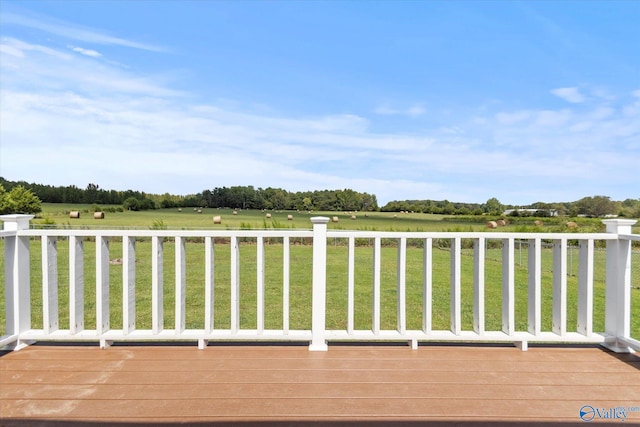 wooden terrace with a yard