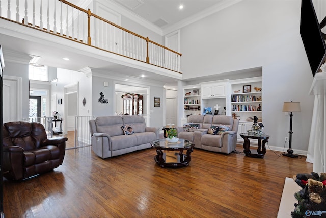 2907 Madrey Ln, Hampton Cove, AL 35763 - living area featuring built in features, dark wood finished floors, ornamental molding, a high ceiling, and recessed lighting