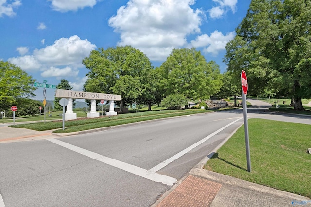 2907 Madrey Ln, Hampton Cove, AL 35763 - view of street featuring traffic signs, sidewalks, and curbs