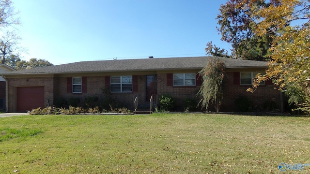 ranch-style home with a front lawn, brick siding, and an attached garage