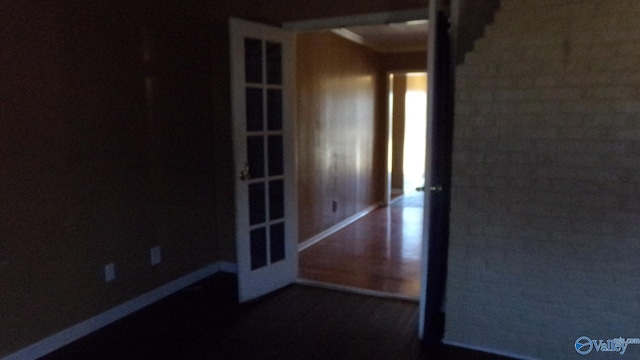 spare room with baseboards