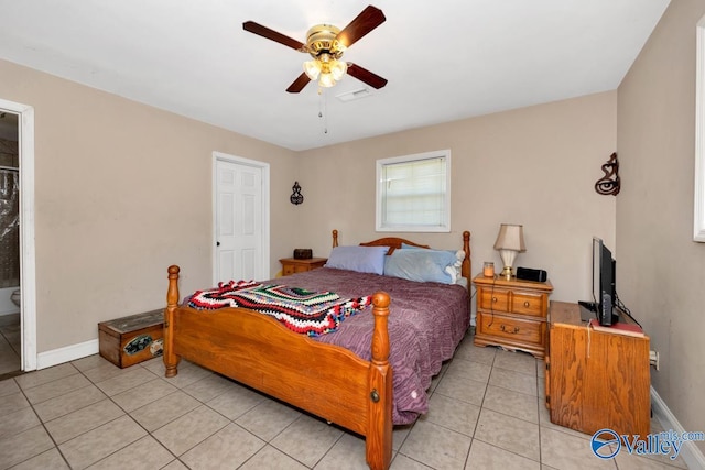 bedroom with light tile patterned flooring, baseboards, ceiling fan, and visible vents