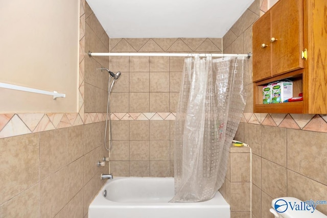 full bathroom featuring tile walls and shower / tub combo with curtain