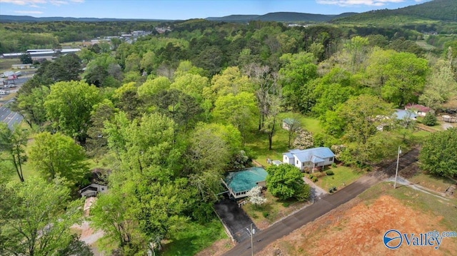 birds eye view of property with a view of trees