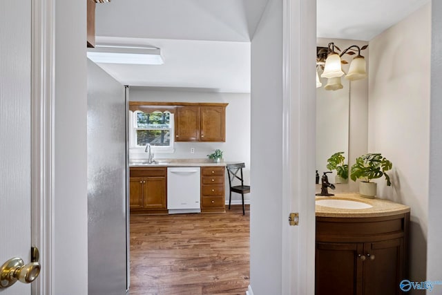 interior space featuring vanity and wood finished floors