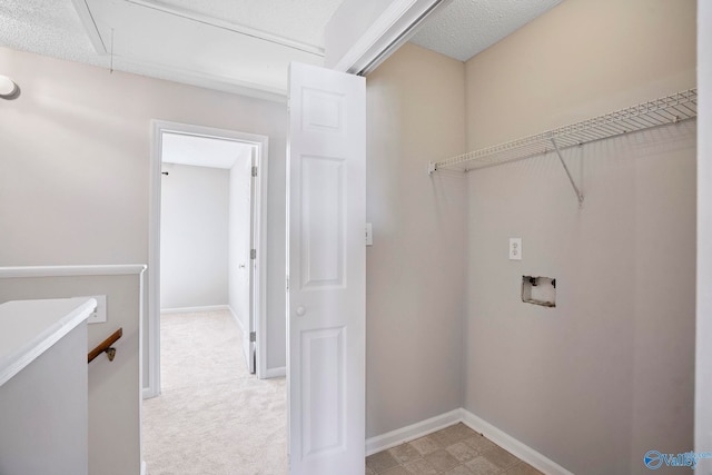 laundry room featuring baseboards, attic access, laundry area, washer hookup, and light colored carpet