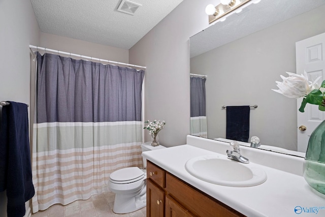 full bathroom with vanity, a shower with shower curtain, visible vents, a textured ceiling, and toilet